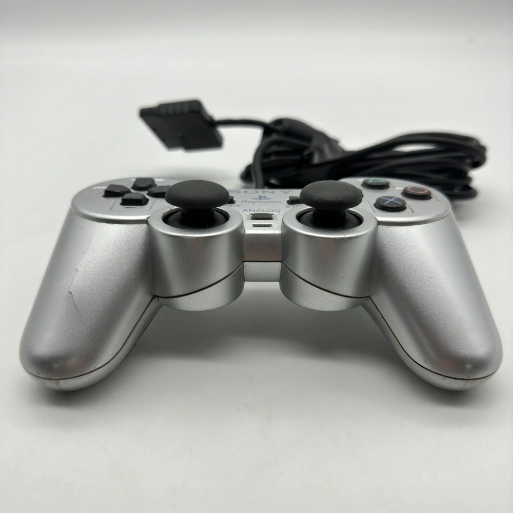 Playstation 2 ovládač (strieborný, popraskaný)