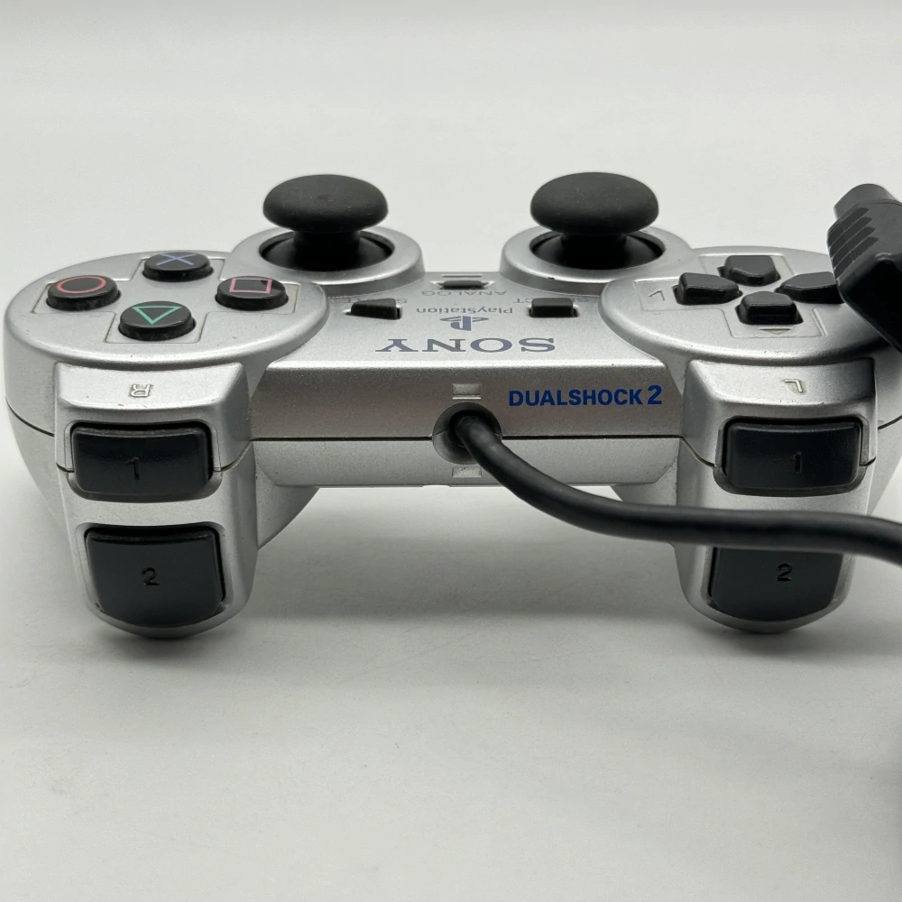 Playstation 2 ovládač (strieborný, popraskaný)
